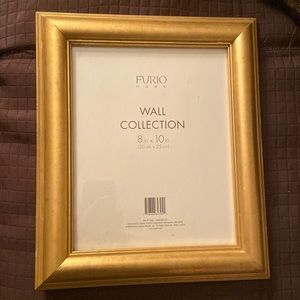 8” X 10” Wooden Gold Frame.  Can be hung or stand